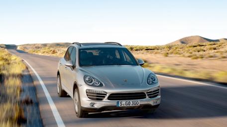 Sleek SUV on Open Road wallpaper