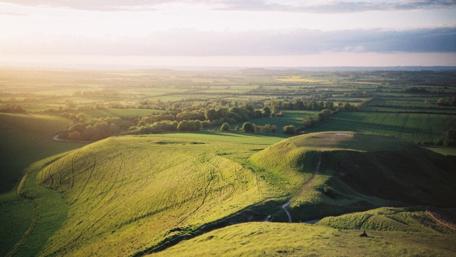 Serene Rolling Hills Under a Vast Sky wallpaper