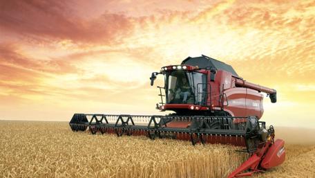Harvesting at Sunset in Golden Fields wallpaper