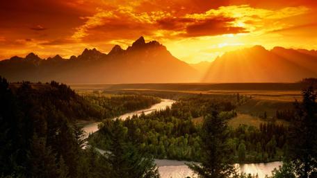 Fiery Sunset Over Serene Landscape wallpaper