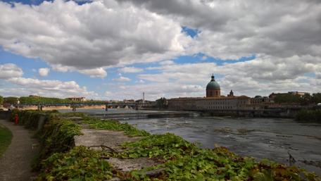 Toulouse Skyline Under Dramatic Clouds wallpaper