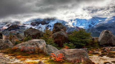 Majestic Mountains Under Cloudy Sky wallpaper