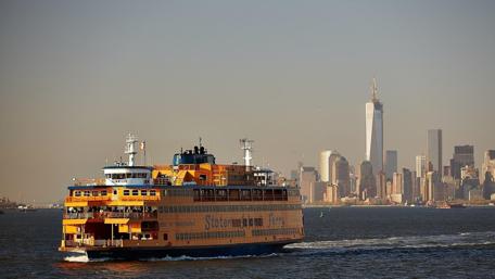 Cityscape with Ferry Scene on Water wallpaper