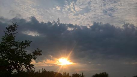 Serene Sunset Over Cloudy Skies wallpaper