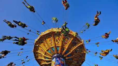 Joyful Thrills of Life's Carousel Experience wallpaper