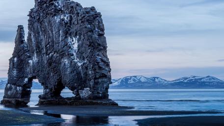 Majestic Cliff Reflection in Serene Waters wallpaper