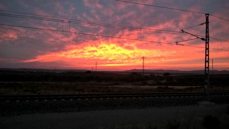 Vibrant Sunset Over Urban Tracks wallpaper