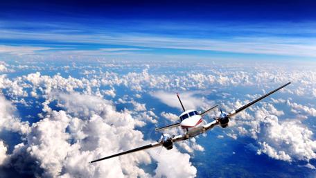 Airplane Flying Above Clouds wallpaper