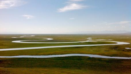 Winding River Through Lush Landscape wallpaper