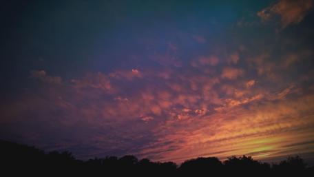 Serene Sunset Over Cloudy Sky wallpaper