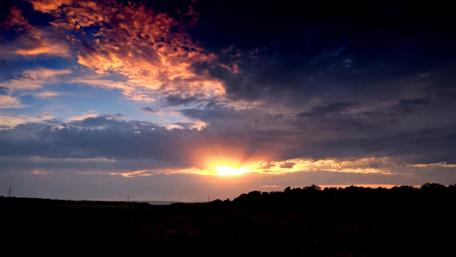 Breathtaking Sunset Over Serene Landscape wallpaper