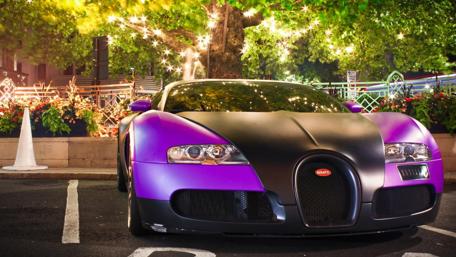 Vibrant Purple Car Under Twinkling Lights wallpaper