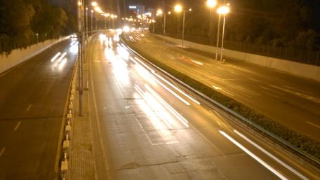 City Lights Dance Over the Freeway at Night wallpaper