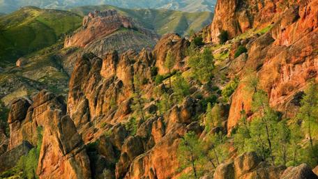 Majestic Hills and Rugged Rocks in Nature's Embrace wallpaper