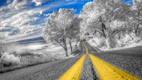 Winding Winter Road under Frozen Sky wallpaper