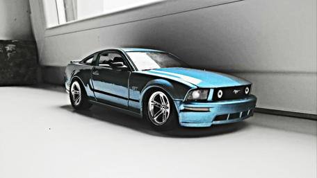 Vibrant Blue Mustang Model Car Wallpaper wallpaper