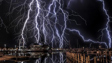 Electric Fury Over Harbor at Night wallpaper