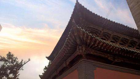 Serene Sunset Over Ancient Architecture wallpaper