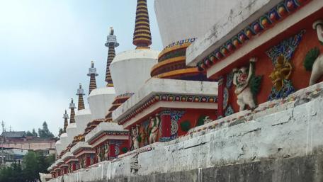 Stunning Cityscape with Colorful Stupas wallpaper