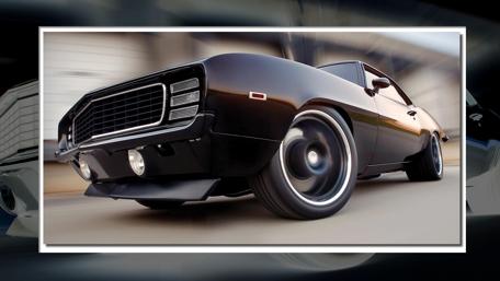 Sleek Black Classic Muscle Car Wallpaper wallpaper