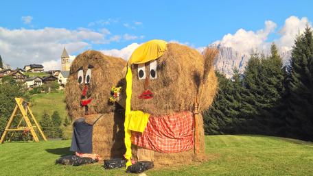 Whimsical Hay Bales Celebrate Togetherness in Nature wallpaper