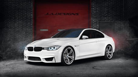 Sleek White BMW M4 in Urban Setting wallpaper