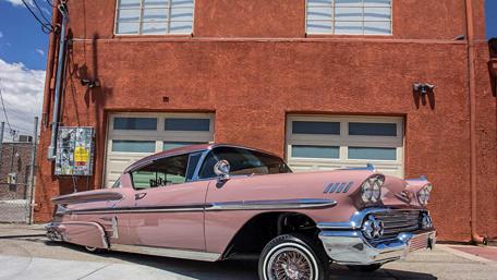 Classic Vintage Beauty on Display in Urban Setting wallpaper