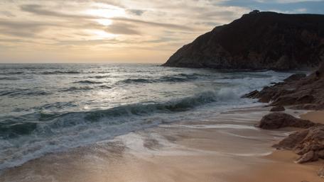 Serene Sunset Over Coastal Waves wallpaper
