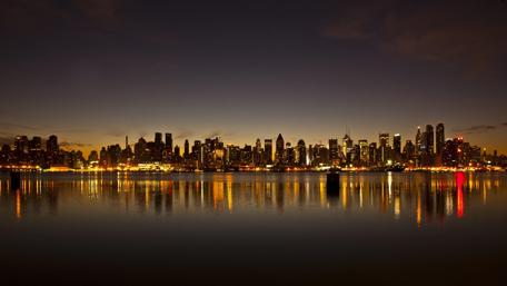 Stunning City Skyline Illuminated at Night wallpaper