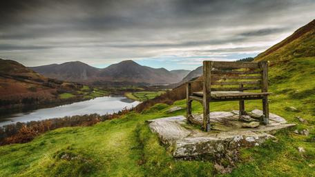 Serene Bench Overlooking Tranquil Loch wallpaper