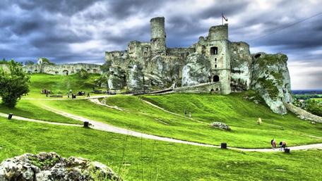 Mystical Castle Ruins in Verdant Fields wallpaper