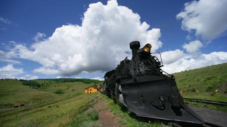Historic Locomotive Against a Scenic Backdrop wallpaper