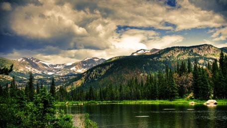 Serene Mountain Landscape with Reflection in Water wallpaper
