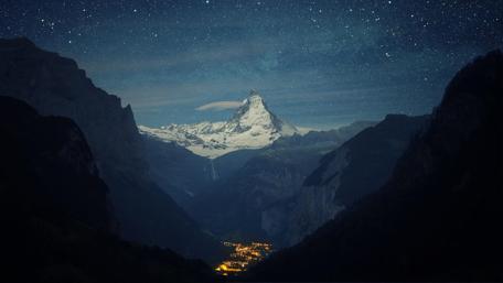 Majestic Mountain Under Starry Night Sky wallpaper