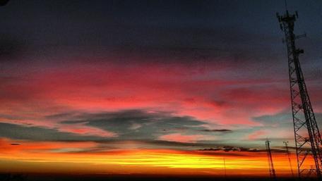 Vibrant Sunset Over a Serene Landscape wallpaper