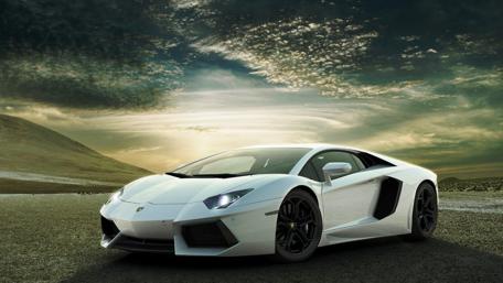 Sleek White Lamborghini on a Desert Road wallpaper