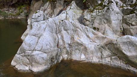 Majestic Rock Formation by the Waterway in Pestisani wallpaper