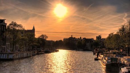 Serene Sunset Over a Tranquil River Scene wallpaper