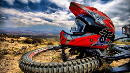 Motocross Adventure Awaits Beyond the Hills wallpaper