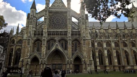 Majestic Architecture of Westminster Abbey in a Sunny Sky wallpaper