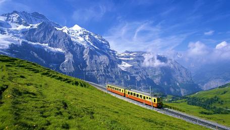 Majestic Train Journey in the Mountains wallpaper