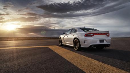 Sleek Performance under Golden Skies wallpaper