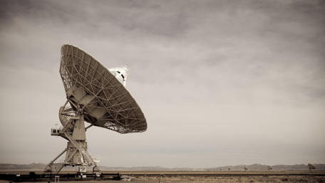 Military Radio Telescope in Vast Landscape wallpaper