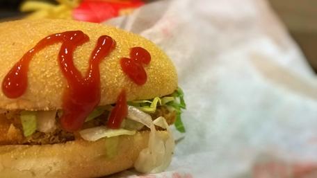 Juicy Burger Delight with Ketchup Swirls wallpaper