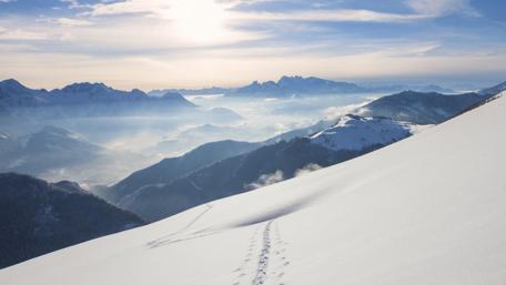 Winter Wonderland Over Snowy Mountain Peaks wallpaper