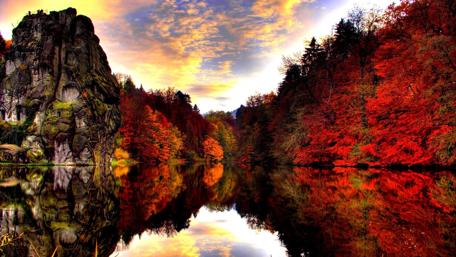 Autumn Cliff Reflected in Serene Lake wallpaper