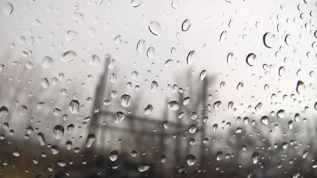 Raindrops on a Windowpane Softly Reflecting Life's Moments wallpaper