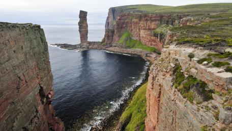 Remote Coastal Cliffs and Tranquil Waters wallpaper