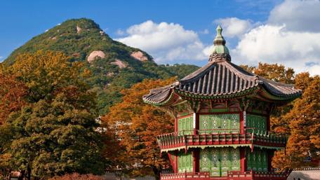 Serene Beauty of Japanese Architecture Under Autumn Skies wallpaper