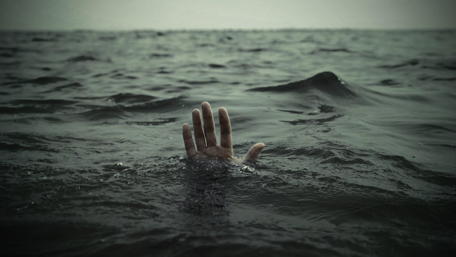 Hand Reaches for Help Amid Waves wallpaper